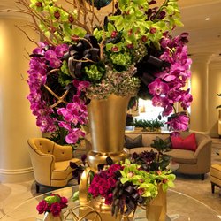Spring Flowers & Gifts - Lobby set up orchids gold vase gold pot