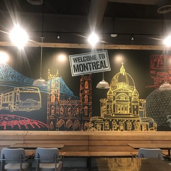 Rock’N Deli - The backdrop with a nice mural of Montreal. - Delis Near Me - Toronto, Ontario