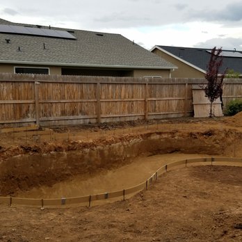 Holiday Pools - a pool being built in a backyard - Pool & Hot Tub Service Near Me - Fresno, California Holiday Pools - a pool being built in a backyard - Pool & Hot Tub Service Near Me - Fresno, California