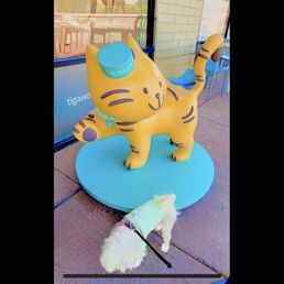 my pup next to the Tigawok mascot