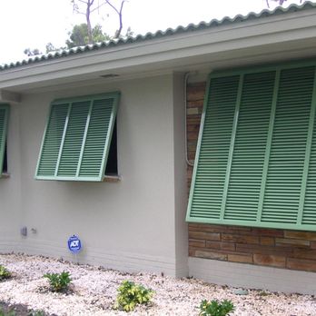 Storm Shutter Warehouse - Bahama shutters give your home a tropical look, and come in a variety of colors. - Shutters Near Me - Fort Myers, Florida Storm Shutter Warehouse - Bahama shutters give your home a tropical look, and come in a variety of colors. - Shutters Near Me - Fort Myers, Florida