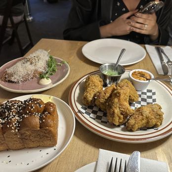 Prubechu - Beef and potato empanada, ko'ko wings, Chamorro sweet rolls, and side of Dinanche' hot sauce - Guamanian Near Me - San Francisco, California