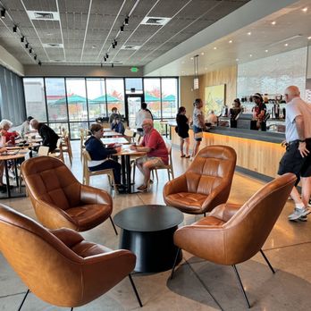Starbucks - a group of people sitting in a coffee shop - Coffee & Tea Near Me - Wildwood, Florida