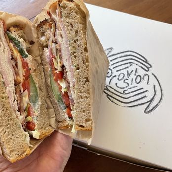 Provision Bread & Bakery - a hand holding a sandwich - Bakeries Near Me - Colorado Springs, Colorado Provision Bread & Bakery - a hand holding a sandwich - Bakeries Near Me - Colorado Springs, Colorado