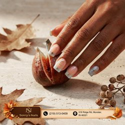 Sonny's Nails - Celestial autumn starlight! Square nails blend sheer nude bases, glittering icy blue French tips, and delicate golden celestial stars. Bo
