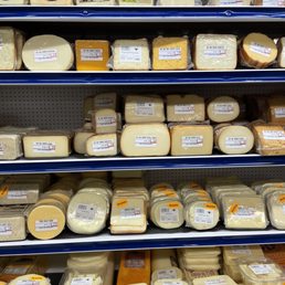 shelves of cheese and cheese products shelves of cheese and cheese products