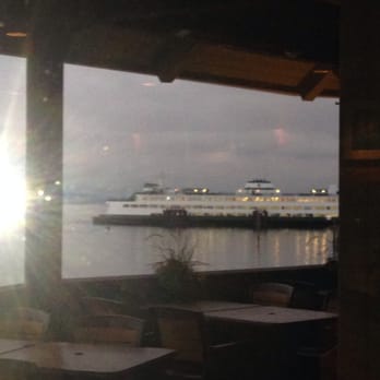Arnies Restaurant Edmonds - View of the ferry out the lounge window. - Seafood Near Me - Edmonds, Washington Arnies Restaurant Edmonds - View of the ferry out the lounge window. - Seafood Near Me - Edmonds, Washington
