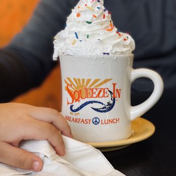 Squeeze In - a cup of coffee with whipped cream and sprinkles - Breakfast & Brunch Near Me - Eagle, Idaho