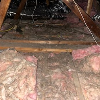 Attic Cleaning Services - Before - old Batt and blowin-in on top of it - Insulation Installation Near Me