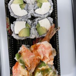 Sushi Train - Avocado cream cheese roll on top and double shrimp roll on bottom.