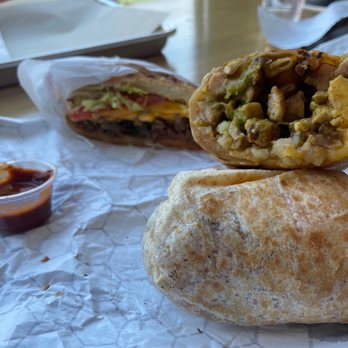 Bodega Park - Trying the Aji breakfast burritos and the chopped cheese.  Amazing texture on the burrito. Wonderful textures, both. - Sandwiches Near Me - Los Angeles, California
