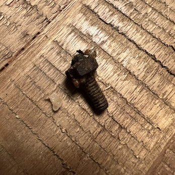 New Canton Restaurant - a screw on a piece of wood - Chinese Near Me - Wheat Ridge, Colorado