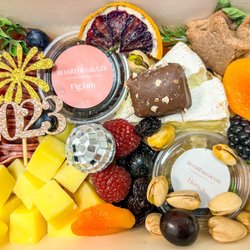 Board and Graze - Personal size charcuterie "board" with New Years theme decor