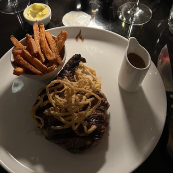 FIRE Steakhouse & Bar - Garlic and thyme infused ribeye, topped with fried onion strings. Accompanied with great house fries and peppercorn sauce. - Brasseries Near Me - Dublin, D