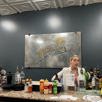 Preez Distillery & Tasting Room - a woman behind the bar - Distilleries Near Me - Largo, Florida Preez Distillery & Tasting Room - a woman behind the bar - Distilleries Near Me - Largo, Florida