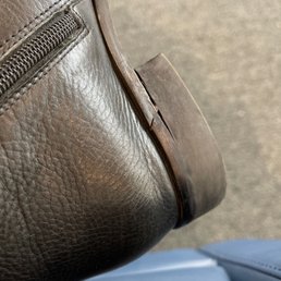 Heel attached messily with a cut that wasn't there before. Heel attached messily with a cut that wasn't there before.