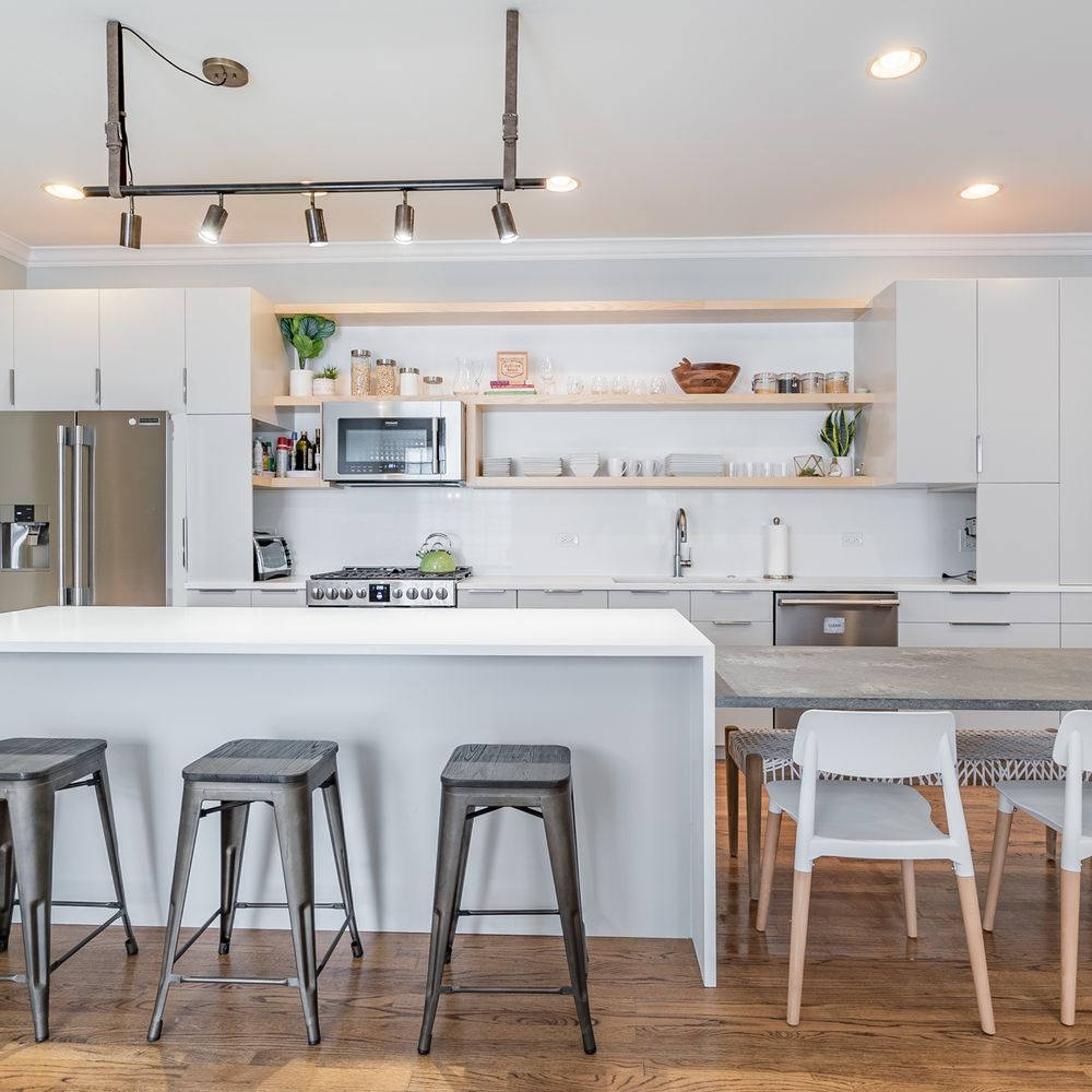 First Choice Remodeling & Development Group - a kitchen with a breakfast bar - General Contractors Near Me - Northbrook, Illinois First Choice Remodeling & Development Group - a kitchen with a breakfast bar - General Contractors Near Me - Northbrook, Illinois