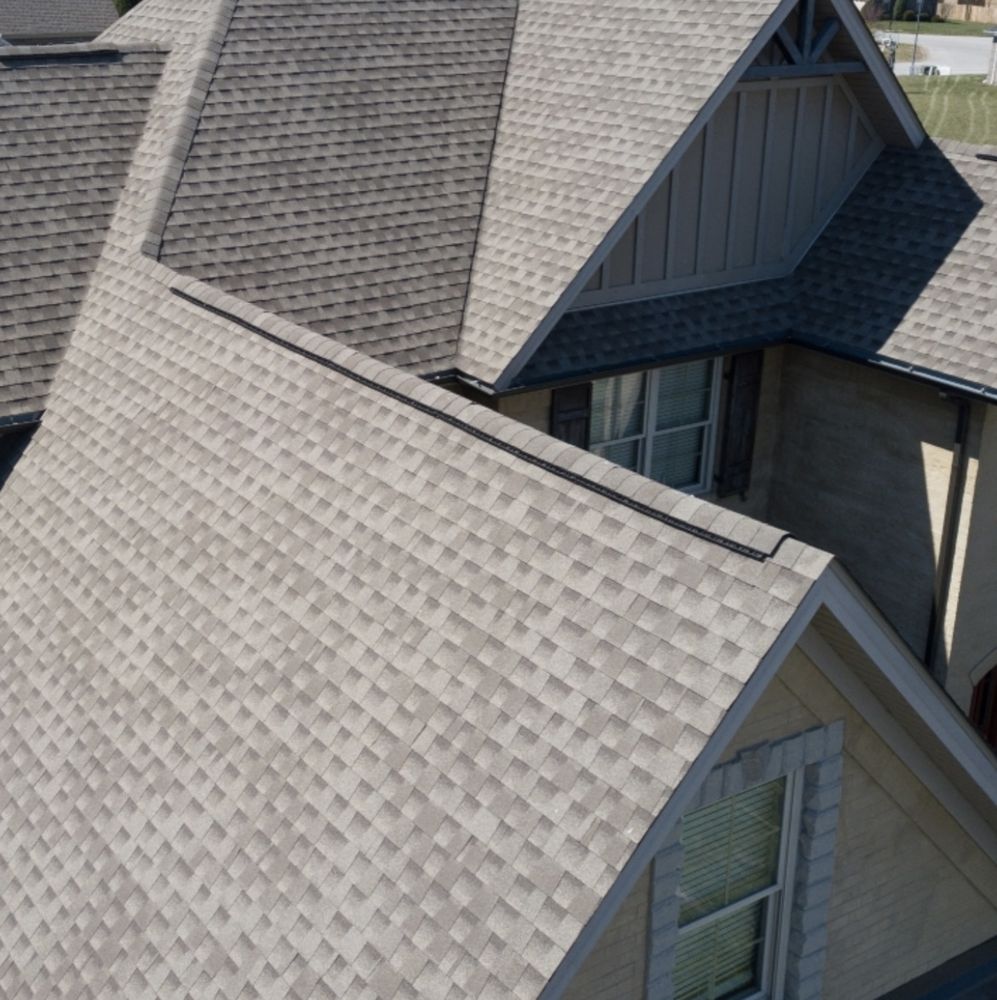 Slide of Her Construction Roofing Specialists 