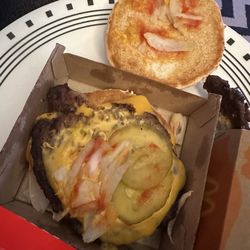 McDonald's - This was SUPPOSED to be a FRESH Quarter Pounder with only cheese & pickles. Notice the 2-tone stale cheese on this hockey puck!