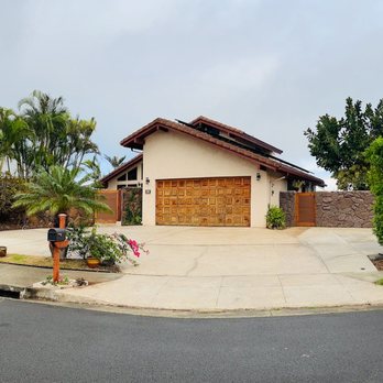 Manoli Builders - MB cleaned up the driveway by excavating, forming and finishing concrete. They also built the moss rock veneer wall - General Contractors Near Me - Kapolei, Hawaii