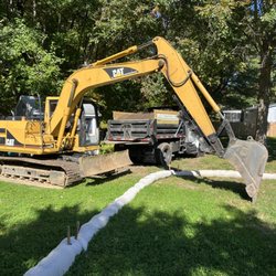 Reliable Excavations - 14 ton excavator and Ford F750 dump truck.
