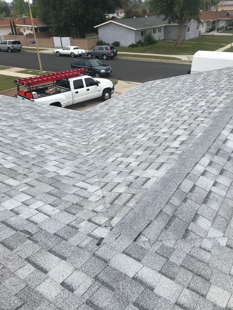 Slide of Mencho's Roofing & Repairs