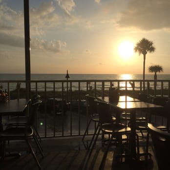 The Brass Monkey - watching the sunset - New American Near Me - St. Pete Beach, Florida The Brass Monkey - watching the sunset - New American Near Me - St. Pete Beach, Florida
