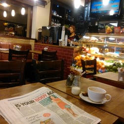 Cappuccino - View across the cafe (not my paper and cup!)