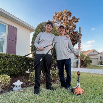 Ultimate Tree and Landscaping Services - two men standing in front of their home - Lawn Services Near Me - Mulberry, Florida Ultimate Tree and Landscaping Services - two men standing in front of their home - Lawn Services Near Me - Mulberry, Florida