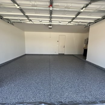 Durable Coatings Arizona - a man standing in a garage - Flooring Near Me Durable Coatings Arizona - a man standing in a garage - Flooring Near Me