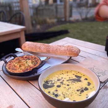 Ruse - a bowl of soup and a pan of bread on a picnic table - Salad Near Me - Saint Michaels, Maryland Ruse - a bowl of soup and a pan of bread on a picnic table - Salad Near Me - Saint Michaels, Maryland