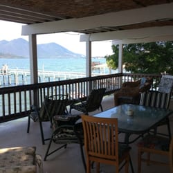 Vista del Lago Lake House and Cottages - Top deck. Really spacious and a GREAT place to sit and watch the boats pass by.