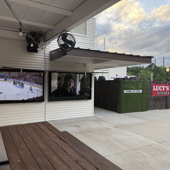 Lucy’s Yard - Front of restaurant with huge TVs for the games - Sports Bars Near Me - Allen, Texas