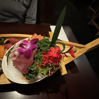 Umi 2 - Sushi plated on a sushi boat with flowers and other decorations - Japanese Near Me - New Orleans, Louisiana Umi 2 - Sushi plated on a sushi boat with flowers and other decorations - Japanese Near Me - New Orleans, Louisiana