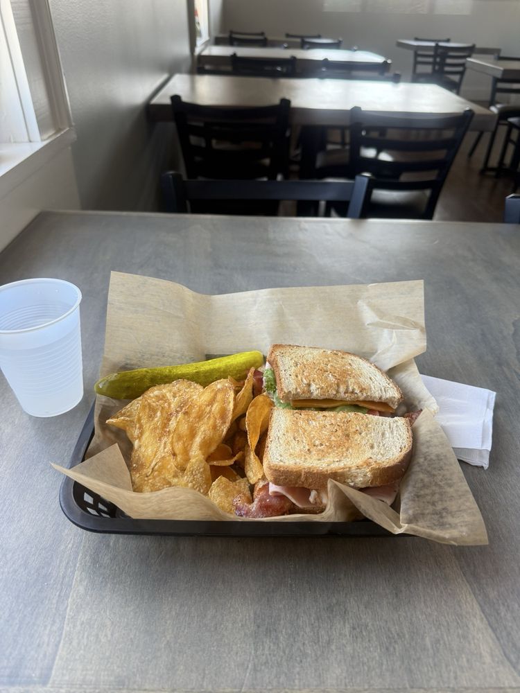 The Deli At Sixth & Main Logo