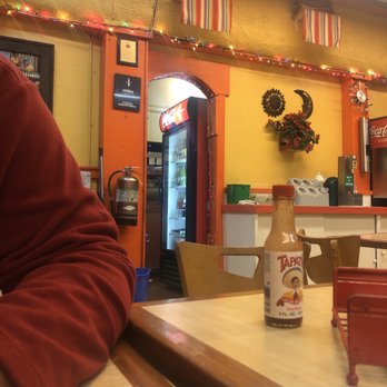 Burger Express - a man sitting at a table in a restaurant - Burgers Near Me - Santa Barbara, California Burger Express - a man sitting at a table in a restaurant - Burgers Near Me - Santa Barbara, California