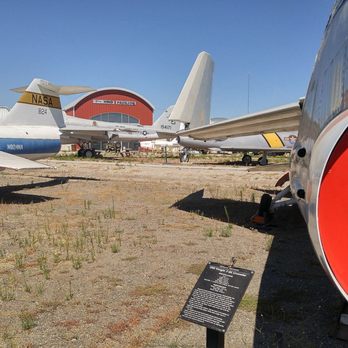 Estrella Warbird Museum - Looking down the guns of an F-8K Crusader towards Hind Pavilion, the main gallery of the museum. - Museums Near Me - Paso Robles, California