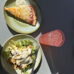 a slice of pizza and salad