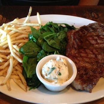 Broken Bit Steakhouse - 20oz. Ribeye With Whiskey Butter Alongside Spinach And Fries. - Steakhouses Near Me - Quartz Hill, California Broken Bit Steakhouse - 20oz. Ribeye With Whiskey Butter Alongside Spinach And Fries. - Steakhouses Near Me - Quartz Hill, California