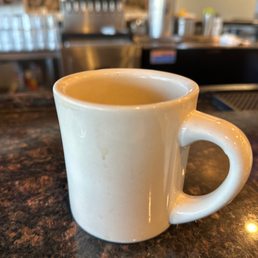 a cup of coffee on the counter