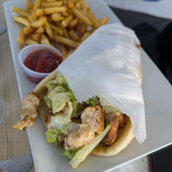 Rafina Greek Taverna - Chicken Caesar wrap $13.95 - Greek Near Me - Boca Raton, Florida Rafina Greek Taverna - Chicken Caesar wrap $13.95 - Greek Near Me - Boca Raton, Florida