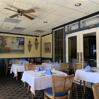 La Mere Michelle - a dining room with tables and chairs - French Near Me - Saratoga, California La Mere Michelle - a dining room with tables and chairs - French Near Me - Saratoga, California