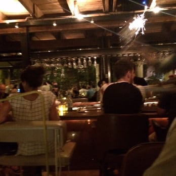 Grinder - My view to the bar from our table.  Fun happy crowd - Steakhouses Near Me - Montreal, Quebec