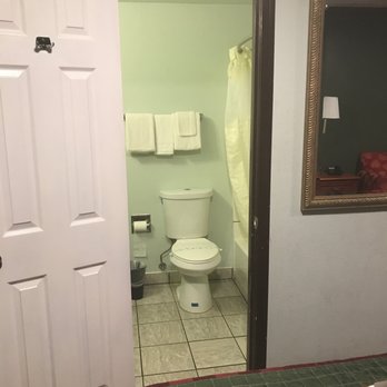 Rodeway Inn - Very small door frame and the door to the restroom is literately hitting the bed - Hotels Near Me - Chico, California