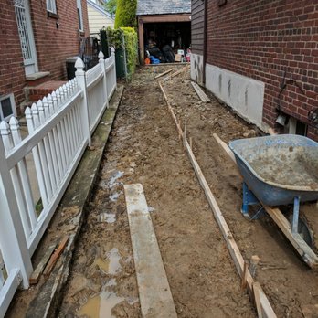 Phil Valenza Contracting - a backyard with a wheelbarrow - General Contractors Near Me - Whitestone, New York Phil Valenza Contracting - a backyard with a wheelbarrow - General Contractors Near Me - Whitestone, New York