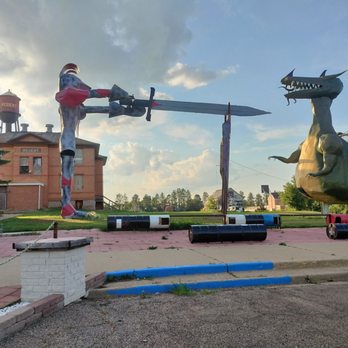 Enchanted Castle Hotel - Knight threatens the dragon with his sword. Time to do some day dreaming - Hotels Near Me - Regent, North Dakota