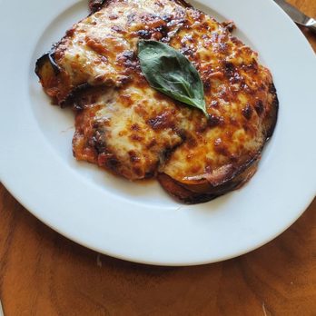 Stella 34 Trattoria - Eggplant Parmigiana (Wood oven roasted eggplant, mozzarella, tomato pumarola, parmigiano). - Italian Near Me - New York, New York Stella 34 Trattoria - Eggplant Parmigiana (Wood oven roasted eggplant, mozzarella, tomato pumarola, parmigiano). - Italian Near Me - New York, New York