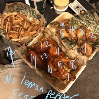 Wingstop - a table full of food and drinks - Chicken Wings Near Me - Santa Monica, California Wingstop - a table full of food and drinks - Chicken Wings Near Me - Santa Monica, California