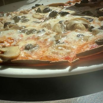 Stix - Thinnest pizza I've ever seen. Very cheese/grease heavy. Stomach ache waiting to happen. - Bars Near Me - Ludington, Michigan