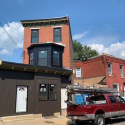 Pace Roofing - Beautifully executed custom black aluminum capping, and black vertical siding.